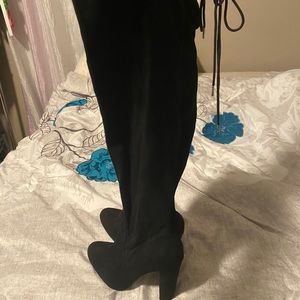 Thigh high heeled boots